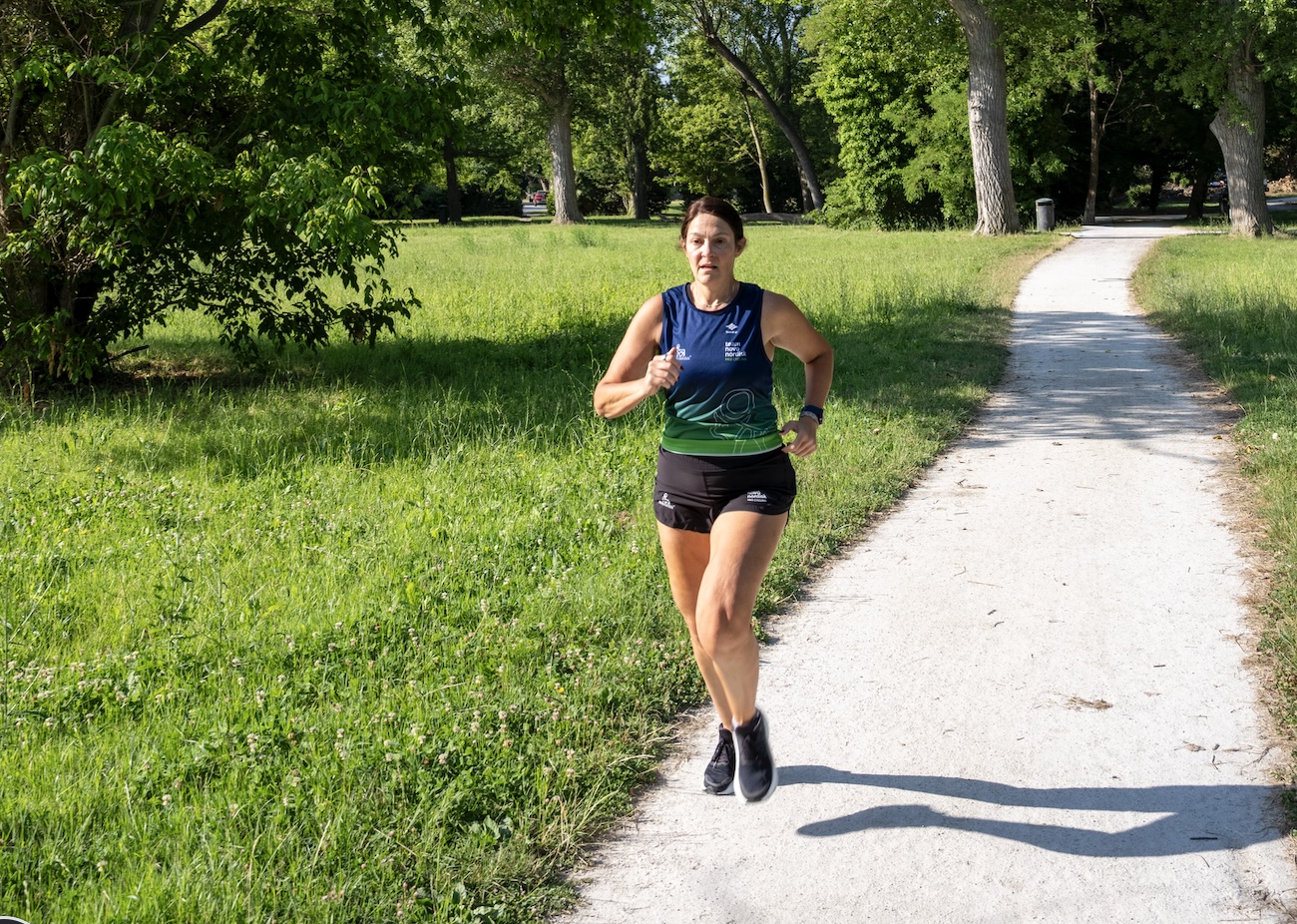 Becky Furuta running on a park path